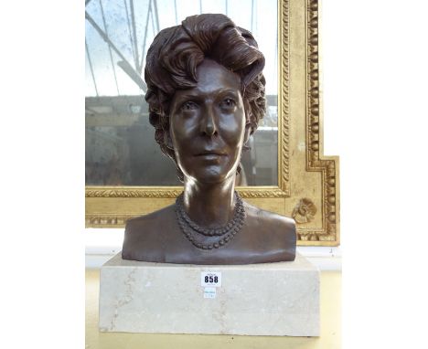 A bronze portrait bust depicting a female subject, signed and dated March 1989 to the rear, on a marble plinth, 47cm high.