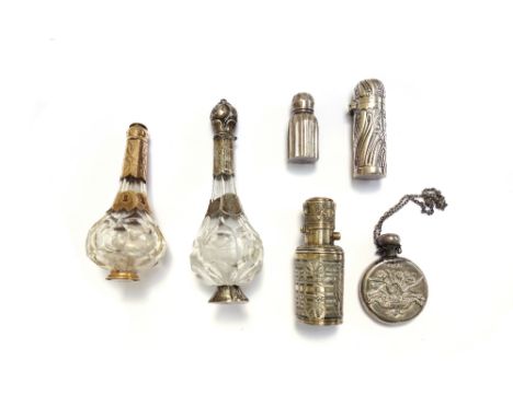 An embossed silver scent bottle, hallmarked Birmingham 1897, 6cm, together with two similar glass and metal mounted scent bot