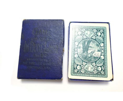 A pack of playing cards by The Fireside Gaming Co., 'In Dixie-Land', copyright 1897; fifty two black and white picture cards 