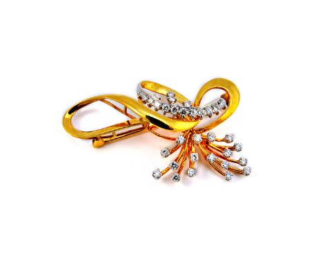 A gold and diamond set brooch, in a wirework spray and interwoven abstract design, mounted with circular cut diamonds, detail