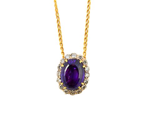 An amethyst and diamond set oval cluster pendant, claw set with the oval cut amethyst at the centre, within a surround of cir