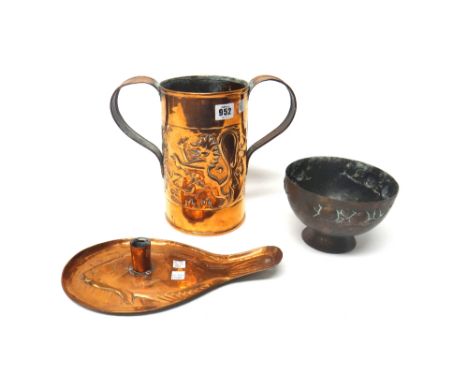 Three copper pieces, early 20th century, comprising; a twin-handled vessel by Keswick, with embossed lion and thistle design,