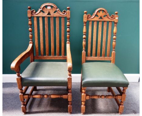 Brights of Nettlebed, a set of eight oak framed dining chairs, with carved arch crest and slatted back, on block and turned s