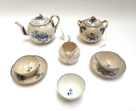 An earthenware blue and white part tea service, in 18th century creamware style, each piece painted with fruit, comprising; t