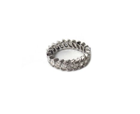 A diamond set full eternity ring, mounted with twenty-one marquise shaped diamonds, in a slanting design, total weight approx