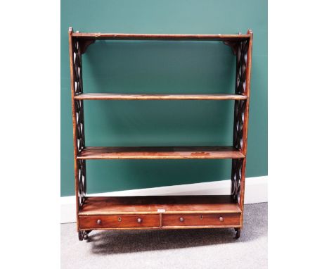 A George III mahogany four tier wall shelf, with pierced fret cut sides, the lower tier with a pair of drawers, 72cm wide.