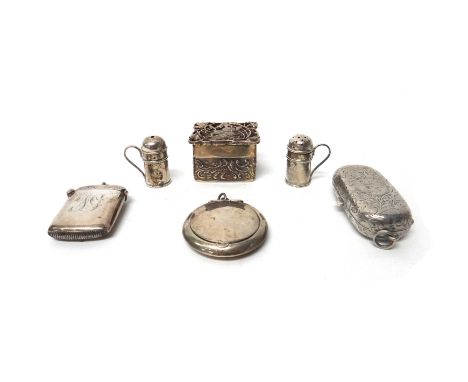 Silver, comprising; a pair of miniature kitchen pepperettes with scrolling handles, London 1984, a twin compartment sovereign