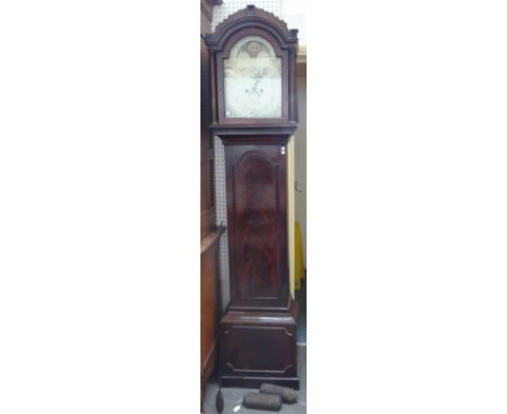 A George III thirty day mahogany longcase clock, 'R. Mann, Reading', with arch top and moon phase aperture, subsidiary second