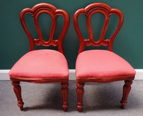 A set of ten Victorian style mahogany dining chairs, with triple arch back and serpentine seat on baluster reeded supports, (