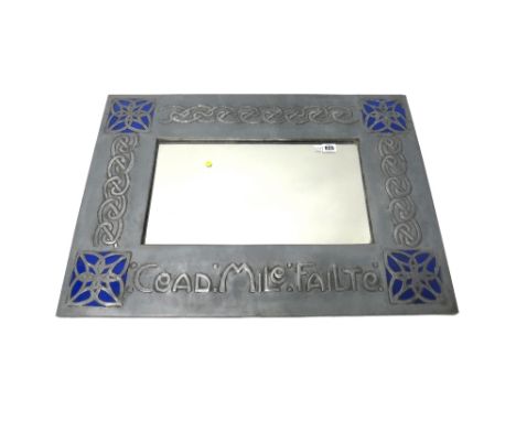 An Arts and Crafts pewter mirror, circa 1900, of rectangular form, decorated with embossed Celtic entrelacs, inscribed 'Cead.