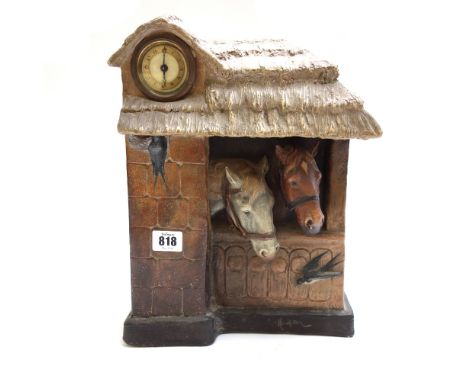 An Austrian terracotta mantel clock, circa 1900, relief cast with horses in a stable, indistinctly signed, 34.5cm high, toget