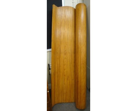A pine tambour screen/room divider, with maker's plaque 'S.N.S.A.', with three shaped tops, 200cm wide x 200cm high.