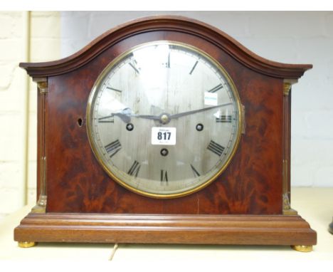 A mahogany cased mantel clock, circa 1900, the domed top over a silvered 7.5 inch dial detailed 'Mappin and Webb', flanked by