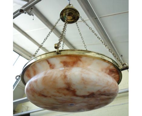 An Edwardian alabaster and cast brass ceiling light, circa 1910, with a broad dished base suspended by five linked chains, 65