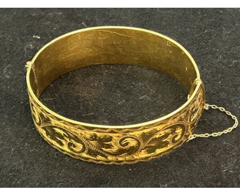 Gold bangle with metal core. Total weight 50.6 grams 