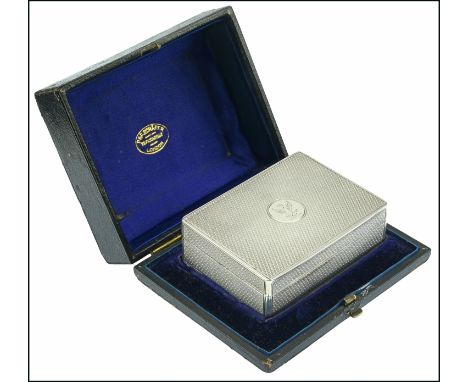 A Victorian silver table vesta case, of engine turned finish, the hinged lid with crest in circular reserve, the compartmente