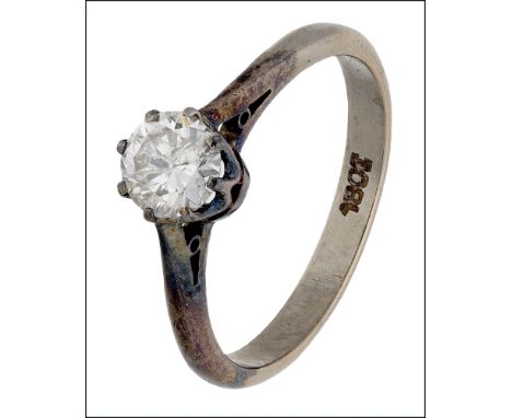 A solitaire diamond ring, the brilliant-cut diamond in eight claw setting, shank stamped ‘18ct’, total diamond weight approxi