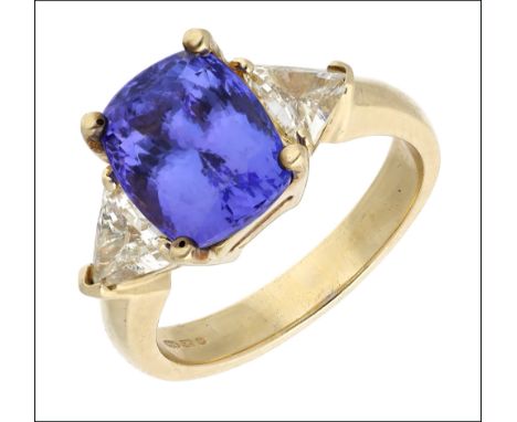 A tanzanite and diamond ring, the mixed-cut tanzanite in four claw setting between diamond set shoulders, each mounted with a