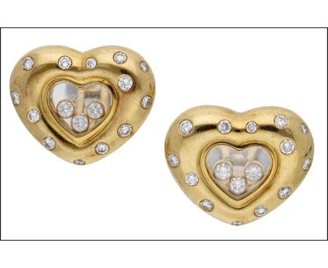 A pair of ‘Happy Diamond’ ear clips by Chopard, the central signed heart-shaped glazed compartments enclosing three ‘floating