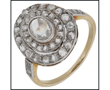 A rose-cut diamond cluster ring, centred with an oval rose-cut diamond within two concentric rows of smaller rose-cuts, betwe