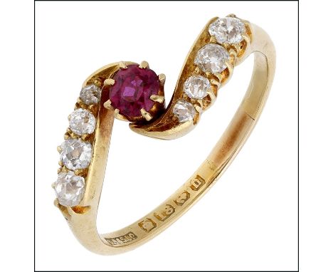 An early 20th century 18ct gold ruby and diamond crossover ring, the ruby between shoulders of graduated old brilliant-cut di