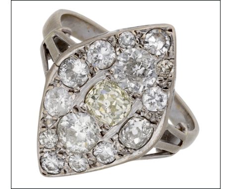 A diamond dress ring, the lozenge-shaped panel pavé set with old-cut, brilliant and single-cut diamonds, between trifurcated 