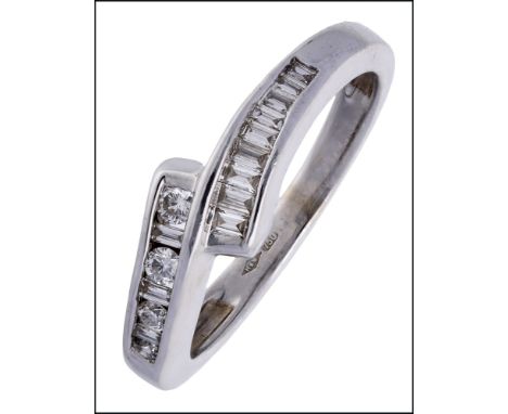 A diamond crossover ring, the front set with graduated rows of baguette and brilliant-cut diamonds, stamped ‘750’, ring size 