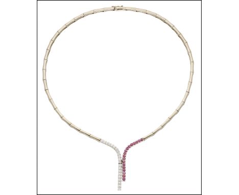 A ruby and diamond necklace, of stylised lariat design, the polished fancy-links leading to two uneven drops, one set with ci
