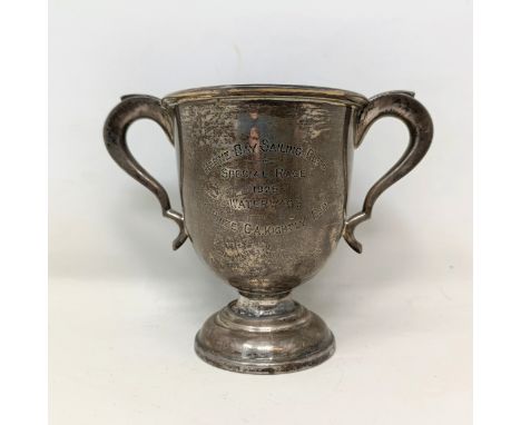 A silver two handled trophy cup, with presentation inscription, Sheffield 1925, 7.6 ozt, 11.5 cm high