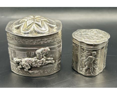 A Dutch silver coloured metal box, decorated figures, 3 cm high, and another similar (2)Total 1.4 ozt