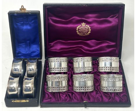 &nbsp;A set of six Victorian silver napkin rings, Sheffield 1887, and another set of four, 6.6 ozt, both cased (2)