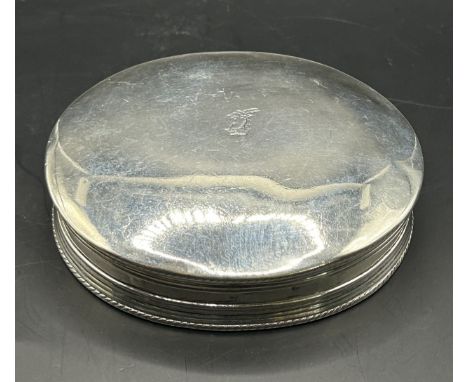 An 18th century oval silver tobacco box and cover, the cover crested, the underside engraved Peter Knowling, marks indistinct