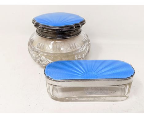 A silver and blue enamel dressing table jar, Birmingham 1930, and another similar (2)