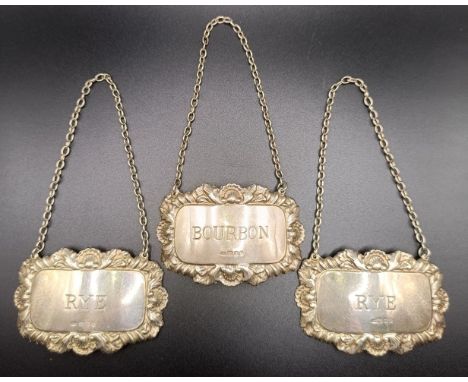 A set of Elizabeth II silver spirit labels, one Bourbon and two Rye, 40.9 g (3)