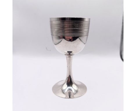 A Japanese Meiji period silver coloured metal pedestal cup, 9 cm high