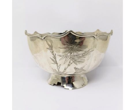 A Chinese silver coloured metal pedestal bowl, of shaped circular form, decorated birds and foliage, 13.5 cm diameter5.7 ozt