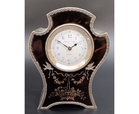 An Edwardian silver and tortoiseshell clock, the white enamel dial with Arabic numerals, signed Edward & Sons Glasgow, 15 cm 