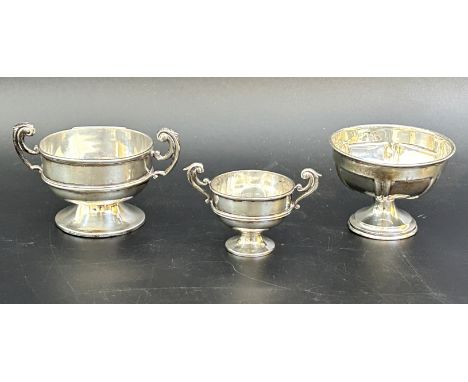 A silver trophy cup, another and a sugar bowl, 5.8 ozt (3)No extra engravings found, bases misshapen and not sitting flat, so