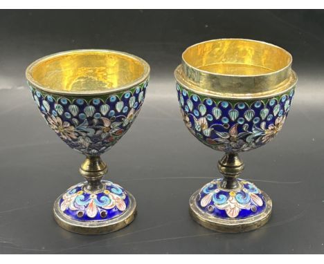 A pair of Russian silver and enamel eggcups, decorated flowers, the tallest 6.5 cm high (2)4.0 ozt (all in)
