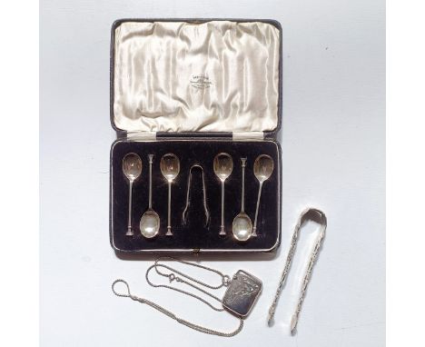 A silver vesta case, Birmingham 1910, on a silver chain, a set of six silver coffee spoons, with tongs, cased, a pair of silv