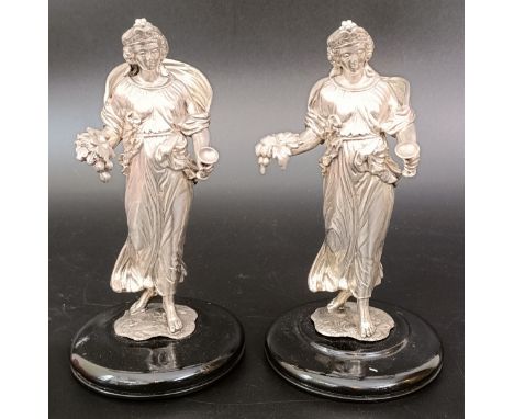 A pair of Victorian silver table centrepieces, in the form of figures, 13 cm high (2)13.3 ozt (all in) Each with lion passant