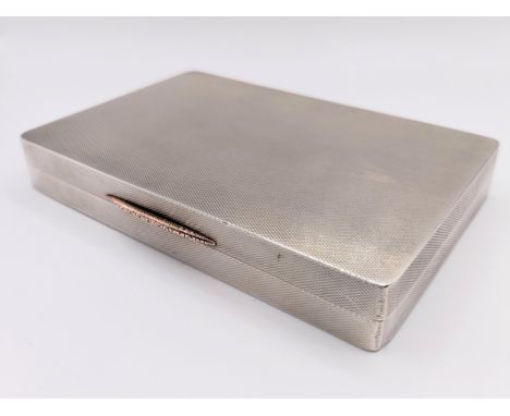A silver box, with engine turned decoration, London 1934, 7.7 ozt, 12 cm wide