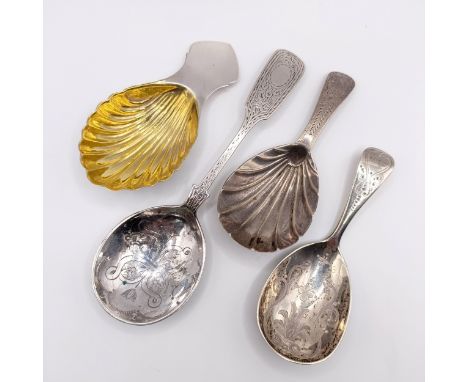 A Victorian silver caddy spoon, and three others similar, 2.1 ozt (4)