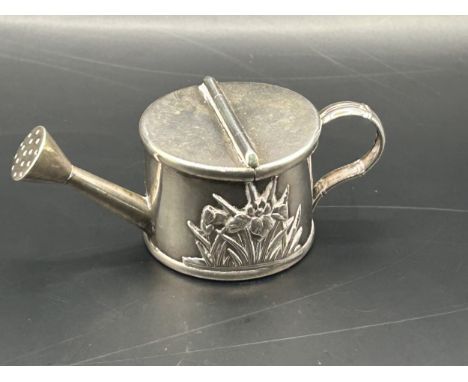 A miniature Chinese silver coloured metal watering can, with a hinged cover, 2.5 cm high0.9 ozt