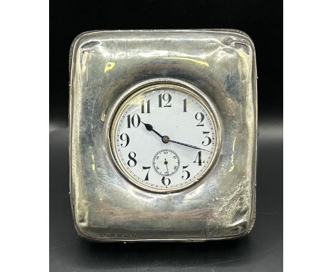 A silver mounted strut watch case, Birmingham 1907, with a Goliath pocket watch (2)