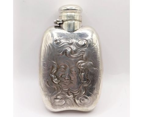 A Gorham sterling silver hip flask, decorated faces, initialled, 2.4 ozt (all in), 11 cm high