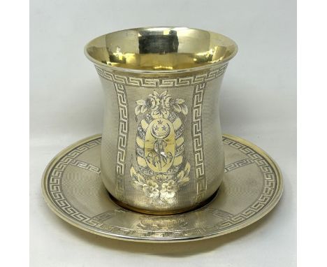A French silver gilt beaker and stand, decorated with Greek key borders, monogrammed, 18.3 ozt, the beaker 13 cm high
