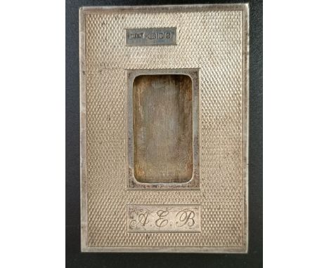 A silver card holder, with engine tuned decoration, initialled, London 1988, 2.0 ozt, 8.5 cm high