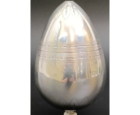 A Russian silver coloured metal egg, with engraved decoration, opening and screwing together to make a goblet, the goblet 11 