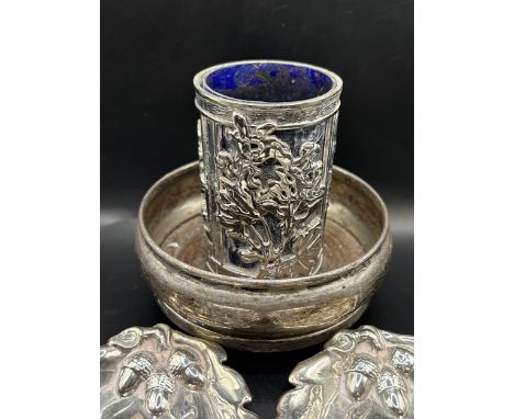 A George V silver bottle coaster, two silver dishes, embossed with oak leaves, and a silver plated&nbsp;&nbsp;case blue glass